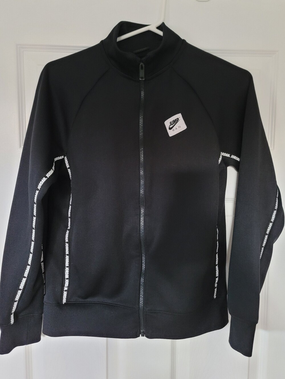 Jordan Youth Size Large, Jumpman Logo Tape Jacket, black. Excellent condition.